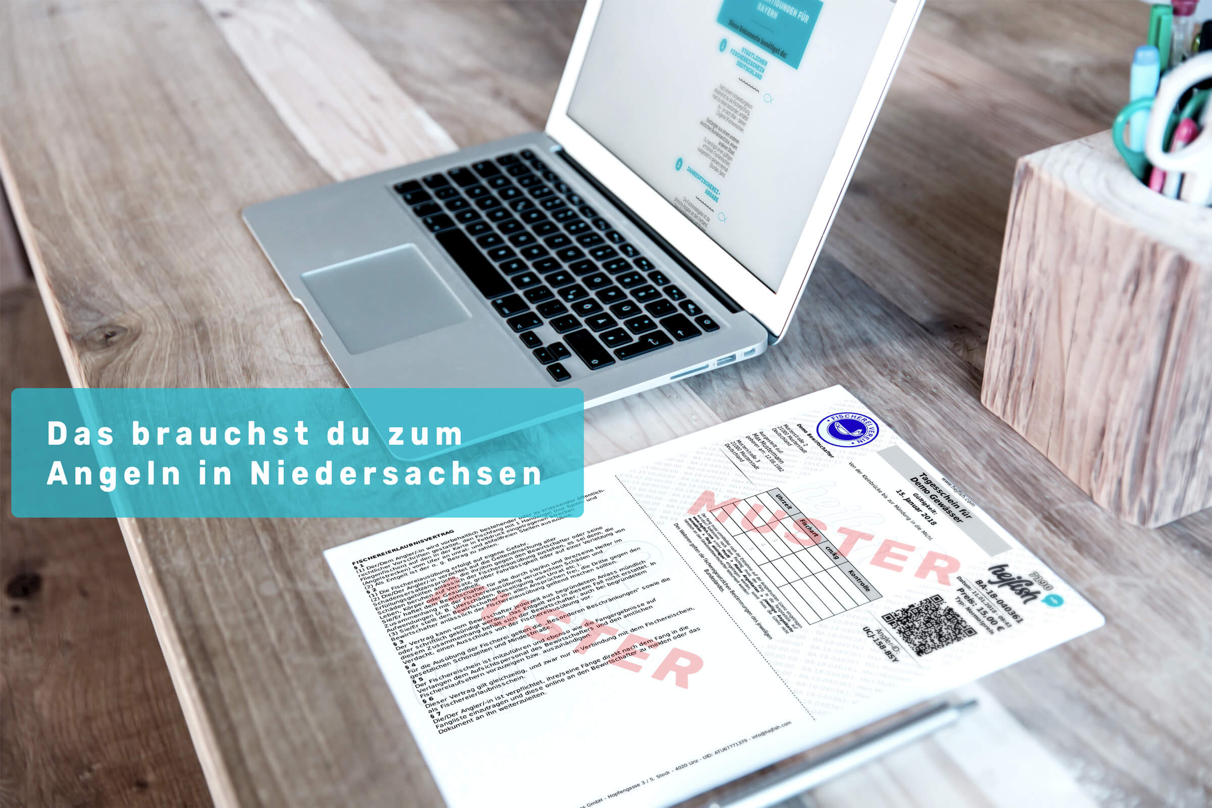 Laptop und Schreibtisch mit Schriftzug " Angelberechtigungen Niedersachsen"